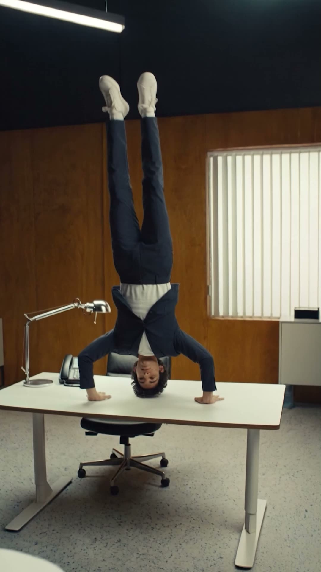 Film scene — handstand on the desk